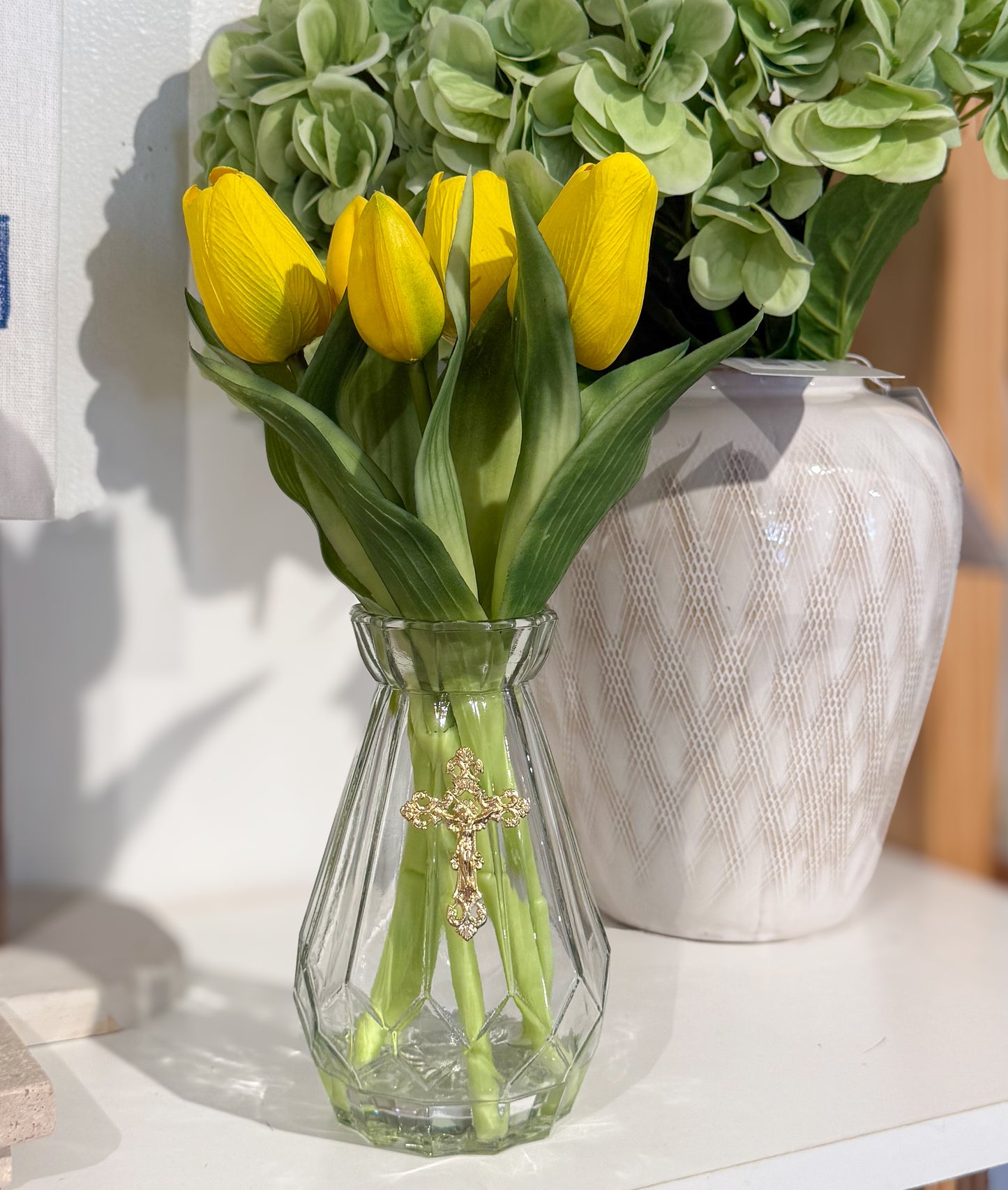 Crucifix on Clear Vase w/ Yellow Tulips